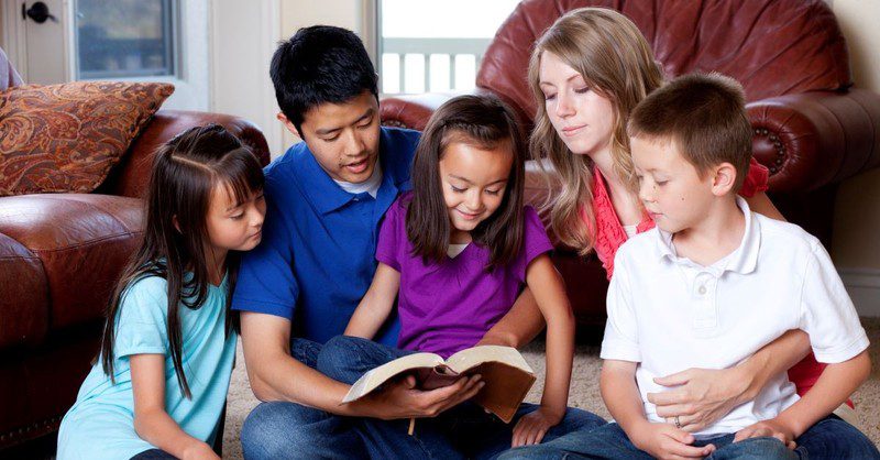 Family reading the Bible